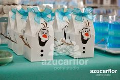 there are some bags that have been decorated with frozen snowman faces on them and blue bows