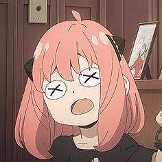 an anime character with pink hair holding a cell phone in her hand and looking at the camera