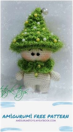 a crocheted stuffed animal wearing a green hat and scarf with snowflakes on it