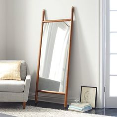 the mid century dowel mirror is on display