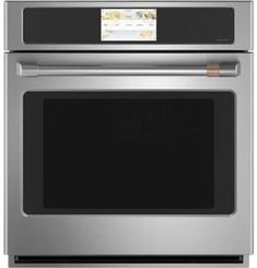 a stainless steel oven with the door open and an empty tag on it's side