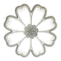 an ornate metal flower decoration on a white background