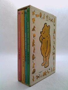 the winnie the pooh books are lined up in front of each other on a white surface