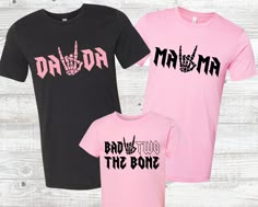 two shirts that say daddy and the bone on them, one in pink and one in black