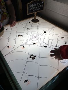 a spider web with bats on it in front of a sign that reads match the shapes