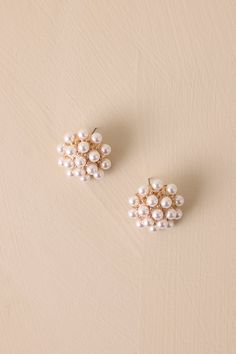 Add some elegance to your look with  Hello Gorgeous Ivory Pearl Cluster Earrings! Perfect for any occasion, these earrings will make you feel like a true stunner in seconds. Plus, who doesn't love a little extra shimmer and shine? Get ready to turn heads with these these pearl cluster earrings! These earrings feature gold hardware, faux ivory pearl clusters, a dome-like shape, and secure post backings.  Earrings Measure 1.5" in Diameter  Imported Teacher Wedding, Pearl Cluster Earrings, Preppy Girls, Going Out Looks, Classic Americana, Fall Staples, Shimmer And Shine, Pearl Cluster, Shimmer N Shine