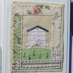 a close up of a greeting card with an image of a birdhouse on it