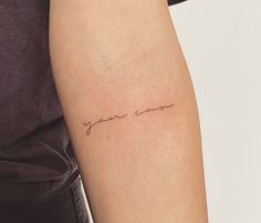 a woman's arm with the word you are loved written in cursive font