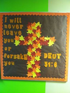 a bulletin board with leaves on it that says i will never leave you or forsake deut you