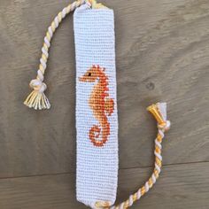 a crocheted bookmark with a sea horse on it