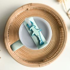 a toothbrush sitting on top of a plate in a bamboo basket next to other items