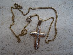 Religious antique French vermeil gold plated chain necklace with vermeil gold plated Christian cross crucifix with transparant stones. I bought the chain with cross on a brocante ( fleamarket ) ( Lille ) in France. Measures Chain: 16,8 inches ( 42 cm ) Measures cross crucifix ; 0,87 x 1,4 inches ( 2,24 x 3,57 cm ) If you don't have paypal you can pay by bank transfer. Registered shipping is possible. For other pictures or information do not hesitate to contact me. I deliver all over the world. Antique Gold Cross Pendant Necklace, Antique Gold Crucifix Necklace, Vintage Gold Cross Pendant Necklace, Chain With Cross, Christian Cross, Bank Transfer, Gold Plated Chains, Blue Stone, Cross Pendant