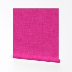 a pink piece of cloth on a white surface with the corner cut out to look like a square