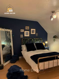 a bed room with a neatly made bed and pictures on the wall