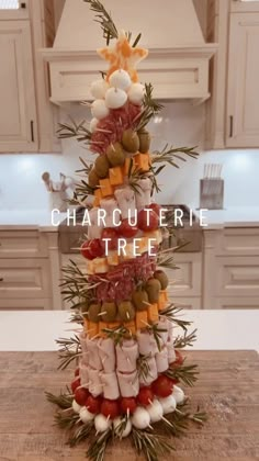 a christmas tree made out of food on top of a wooden table