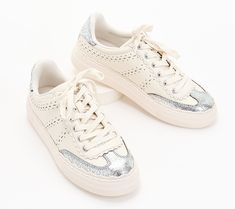 This casual chic leather sneaker adds panache to loungewear on laidback days. Plus, the neutral color combo and platform sole elevate the look. From Vince Camuto. Trendy Cream Sneakers With Perforated Toe Box, Trendy Spring Platform Sneakers With Perforations, Trendy Platform Sneakers With Perforations, Casual Cream Sneakers With Studded Outsoles, Chic Leather Sneakers With Perforations, Chic Sneakers With Perforated Toe Box, Chic Low-top Sneakers With Perforations, Chic Lace-up Sneakers With Contrast Sole, Vince Sneakers