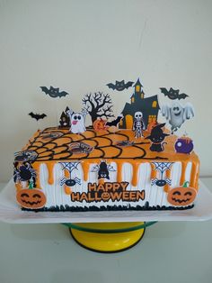 a decorated cake with halloween decorations on it