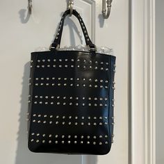 Fendi Authentic Black/Silver Studded Tote With Yellow Lining. Serial Number Is Stamped On Inside Pocket. Measures: 11”H X 9”L X 3”W Never Worn. Has Little Scratch From Storage (Shown In Pic) Otherwise Perfect Condition. Designer Bags With Silver-tone Hardware For Night Out, Designer Evening Bags With Silver Accents, Black Luxury Bags With Silver Accents, Luxury Black Bags With Silver Accents, Fendi Monster Bag, Rolling Tote Bag, Fendi Tote Bag, Fendi Purses, Fendi Monster