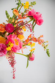 an arrangement of colorful flowers in a vase