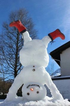 a snowman has his head in the air