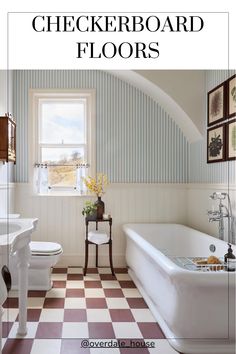 a bathroom with checkerboard floors and white fixtures