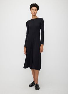 A classic fit-and-flare dress designed for modern comfort. Crafted from a soft Modal Rib knit, the Poise High Neck V-Back Dress features an elegant silhouette and midi length, with a fitted bodice and flared skirt, plus built-in stretch for unlimited motion. Thoughtfully constructed to stand the test of time with merrow stitching and built-in shape retention. A playfully polished bateau neckline and deep v-back make this a go-to dress for effortless all-day (and night) wear. Kit And Ace, Bateau Neckline, Night Wear, Flared Skirt, Fitted Bodice, Long Sweaters, Fit And Flare Dress, Dress Backs, Flare Skirt