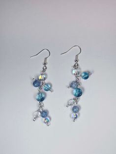 These are dangly earrings that give off bubble or rain vibes. They made me think of the anime movie Weathering With You. These would go well with a lot of outfits that need a little pop! Rain Vibes, Rain Earrings, With You, Film D'animation, Summer Rain, Dangly Earrings, Anime Movies, Jewelry Earrings Dangle, Etsy Earrings