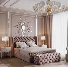 a bedroom with a large bed and chandelier