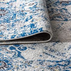 an area rug with blue and white colors