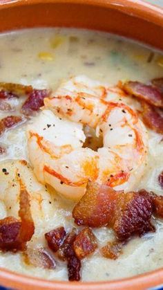 a bowl of soup with shrimp and bacon