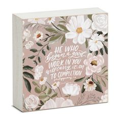 a pink and white box with flowers on the front, saying he who is god won't be in you will become at one to completion