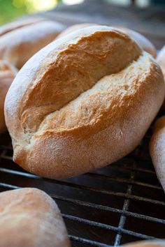 several loaves of bread cooling on a rack