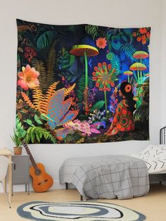 a room with a bed, rug and wall hangings that have colorful flowers on it