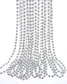 several silver balls hanging from the ceiling on a white background with clipping for text