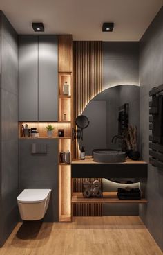 a modern bathroom with wood paneling and grey walls, along with a white toilet