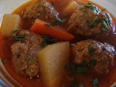 meatballs, potatoes and carrots are in a bowl