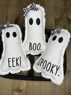 three white pillows with black polka dots and the words boo spooky on them