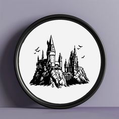 a black and white clock with a castle on it