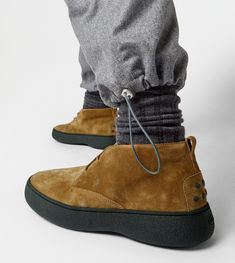 Characterized by a chunky but at the same time sober and refined outsole, the Tod's W. G. style is here proposed in desert boot version. Crafted in suede, with iconic rubber pebbles on the bottom and heel, they are enhanced by Tod's monogram stamped on the front. Desert Boot, Desert Boots, Chukka Boots, Ankle Boot, Online Store, Monogram, Boots, Heels