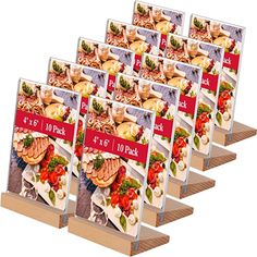 six cookbooks are stacked on top of each other, with the covers folded down