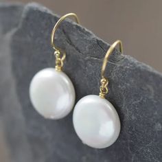 These earrings showcase AAA-grade, high-luster pearls that radiate pure sophistication. Each pearl, with its unique natural beauty, varies slightly in size, ranging between 12-14mm in a captivating coin shape. Adorned with delicate (but durable) gold-filled wires, these earrings effortlessly enhance the white pearls' inherent allure. We take pride in meticulously pairing each pearl to ensure a harmonious duo. Gift Pearl Earrings With French Hook, Everyday Round Hypoallergenic Pearl Earrings, Everyday Hypoallergenic Round Pearl Earrings, Pearl White Drop Pearl Earrings In 14k Gold Filled, 14k Gold-filled Pearl Drop Earrings In Pearl White, 14k Gold Filled Pearl Drop Earrings In Pearl White, Pearl White 14k Gold Filled Drop Earrings, 14k Gold-filled Pearl White Drop Earrings, Gift Pearl Earrings With Ear Wire