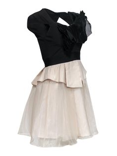 Bring a retro vibe to your next formal event with this dress from Karen Millen! This two-toned piece features ruffles and tulle that give this dress an '80s-inspired twist. Pair with pumps and statement earrings for a throwback look. Size 4 Shell: 88% Polyester, 12% Elastane Lining: 100% Polyester Exposed back zipper w/ large buttoned keyhole cutout Lined Fit and flare silhouette Sweetheart neckline Cap sleeves Ruffled design on bust Two tiered skirt w/ tulle overlay Bust 30" Waist 25" Sleeve le Fitted Prom Dress With Ruffled Skirt, Black Fitted Dress With Tulle Skirt, Fitted Black Tulle Dress, Fitted Black Dress With Tulle Skirt, Fitted A-line Dress With Tulle Skirt, Fitted Ruffle Dress For Prom With Ruffled Skirt, Chic Fitted Ruffle Dress For Wedding, A-line Evening Dress With Ruffles For Prom, A-line Evening Dress With Ruffles For Prom Season