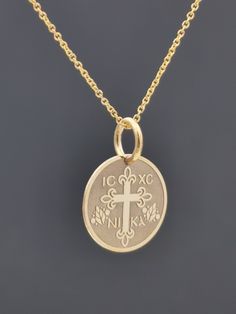 "Personalized 14k Solid Gold Dainty Cross Coin Necklace For Protection, Greek Orthodox Jewelry, ICXC NIKA Coin Pendant, Baptism Gift for Girl 0.5 Inch (12.7mm) Diameter pendant 14k Solid Gold ♥ Material of pendant and chain: Solid Gold 14K ♥ Packaging: All of our jewelry is beautifully boxed and ready for gifting For more personalized designs take a look here: ♥ www.etsy.com/listing/631444472 ♥ www.etsy.com/listing/645292671 ♥ www.etsy.com/listing/645282627 ♥ www.etsy.com/listing/631455364 ♥ www Classic 14k Gold Jewelry For First Communion, Classic 14k Gold Jewelry For Baptism, 14k Gold Jewelry For First Communion, Engraved Yellow Gold Jewelry For First Communion, Gold Engraved Jewelry For Baptism, Yellow Gold Round Jewelry For First Communion, Orthodox Jewelry, Personalized Cross, Greek Orthodox