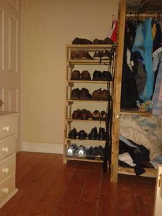 the closet is full of shoes and clothes