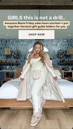 a woman in white is standing on a bed with an advertisement above her head that says, girls this is not a drill