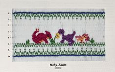 a cross stitch pattern with animals and plants on the bottom, along with green grass