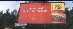 an advertisement for a burger restaurant on the street