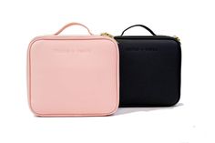 two black and pink cases sitting next to each other on a white surface, one has a zippered closure