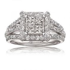 a square shaped diamond ring with double rows of diamonds on the band and shoulders, set in white gold