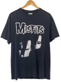 a black t - shirt with the words misfis printed on it